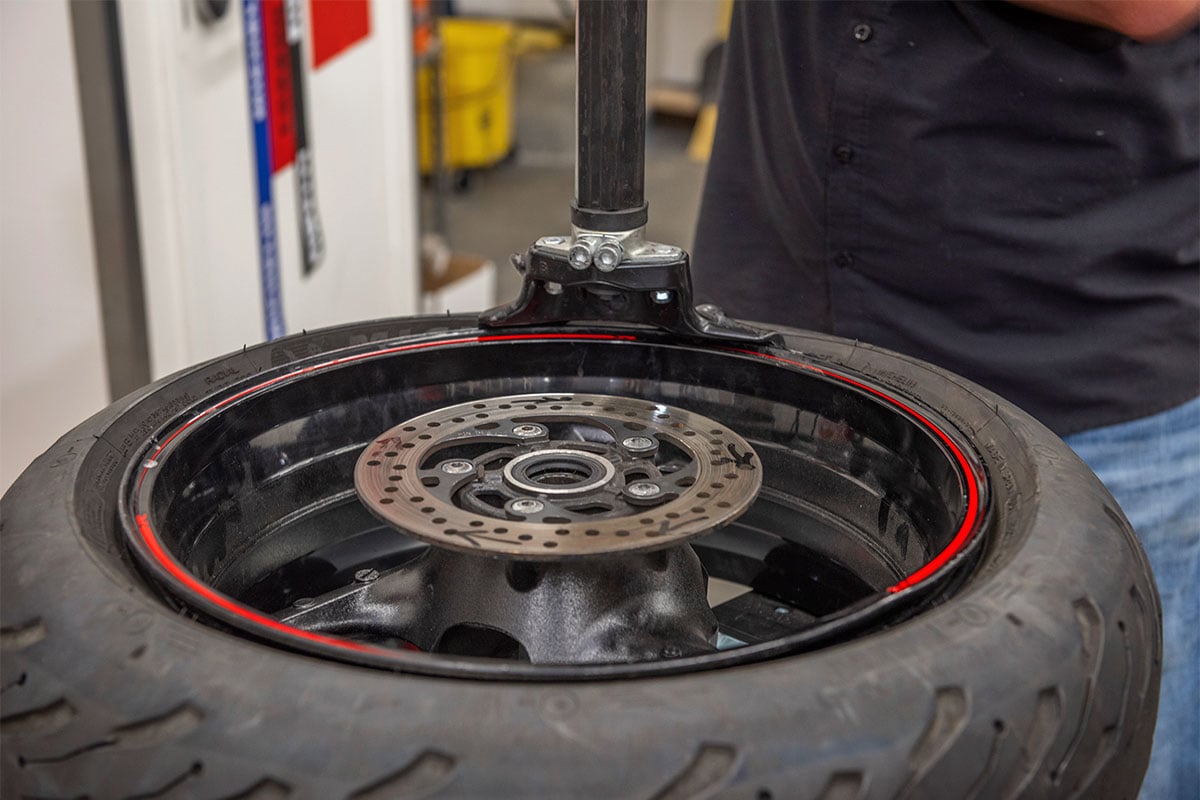 hunter motorcycle wheel service with smartweight pro wheel balancer and tcx table-top tire changer at cycle gear